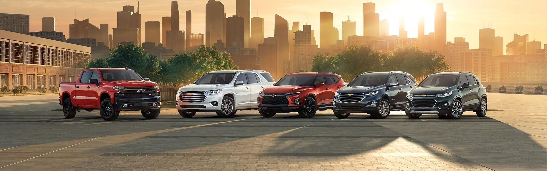 Chevrolet vehicle lineup displayed in a city setting.