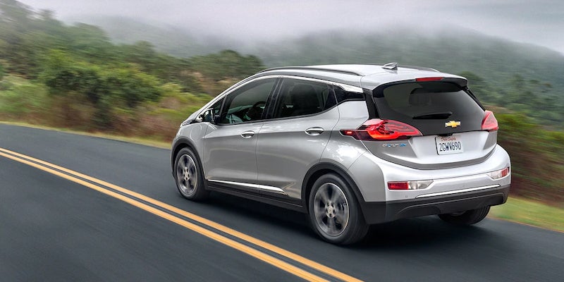 Used Chevy Bolt EV driving on scenic highway