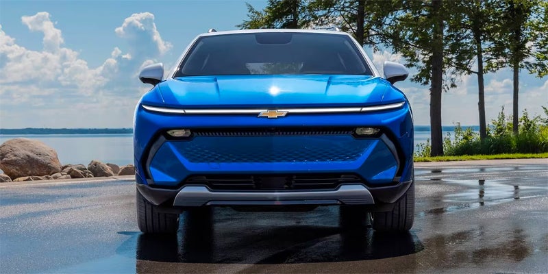 Blue 2024 Chevy Equinox EV in tropics